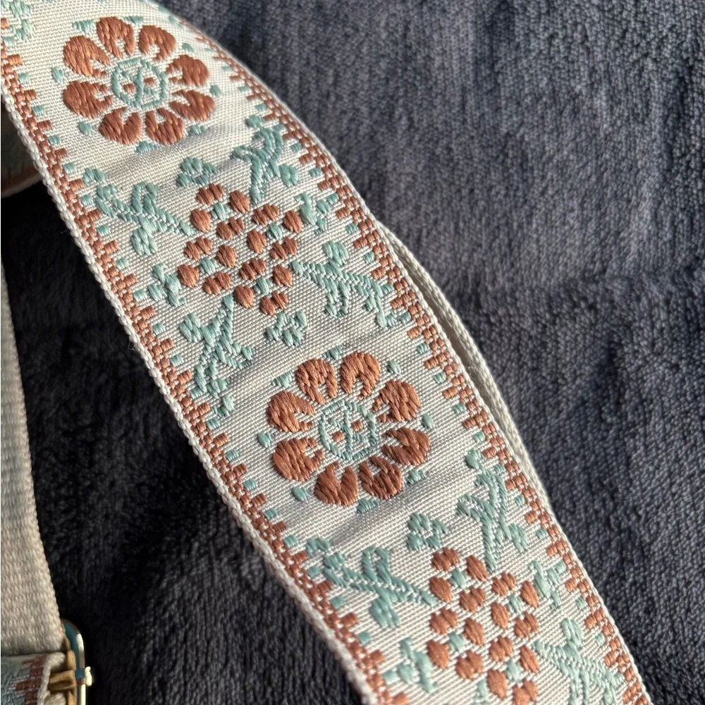 Brown Vegan Leather Sling‎ Bag with floral strap.